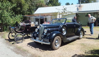 1902 Oldsmobile & 1935 Chysler.